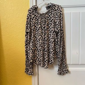 Shirt is a small and it is lose and flowy